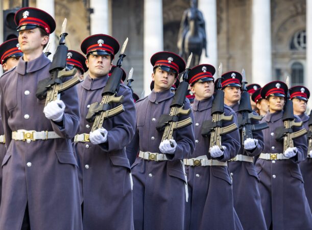 A few Reservists during the Lord Mayor's Show holding their rifles and saluting the Lord Mayor